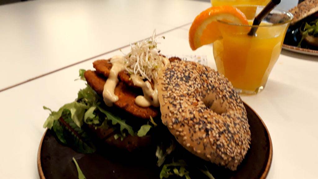 Vegan BLT bagel and freshly squeezed orange juice from the SAP Bagel & Juice Bar