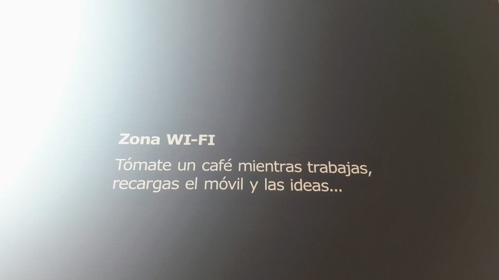 "WiFi zone. Drink a coffee while you're working, you're charging the mobile and the ideas ..." It couldn't be more accurate ;)
