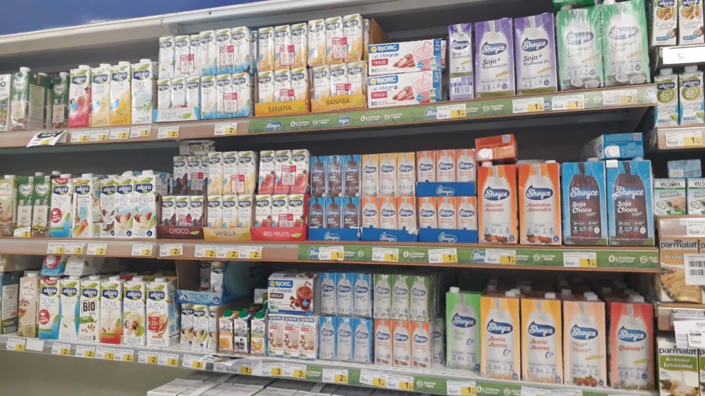 Plentiful selection of non-dairy milk: soy, rice, almond, coconut, oat, ...